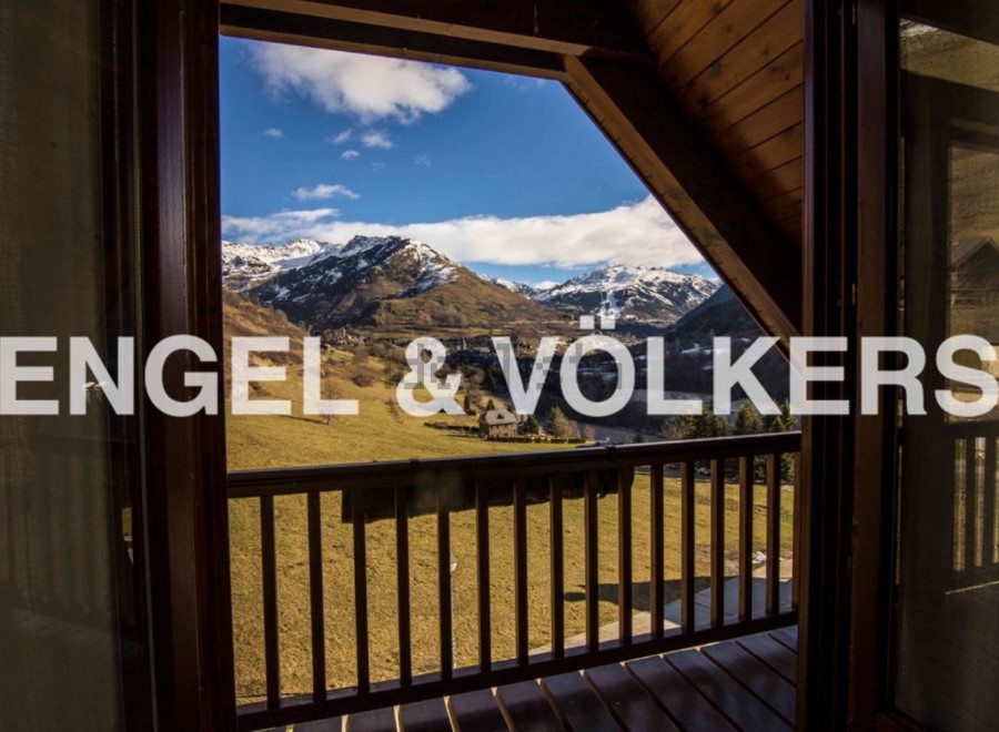 Mountain view chalet with spacious balcony.