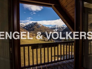 Mountain view chalet with spacious balcony.
