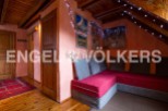 Cozy chalet retreat with stunning mountain views and unique decor.