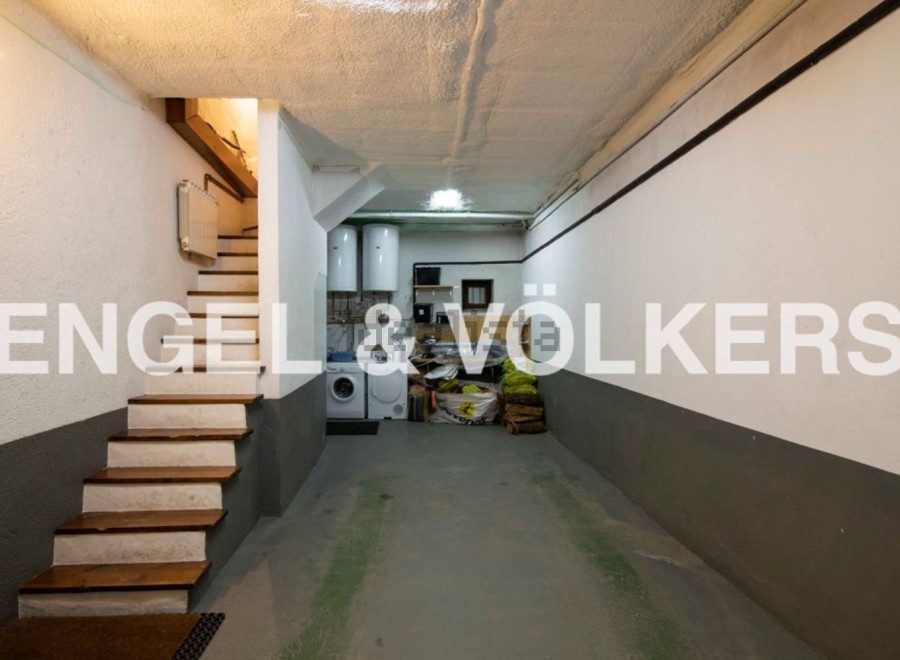This spacious garage offers ample storage and parking space, complete with a convenient laundry area.
