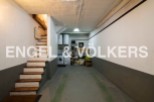 This spacious garage offers ample storage and parking space, complete with a convenient laundry area.