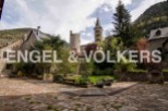 This stunning property boasts a charming courtyard garden, perfect for relaxing and enjoying the mountain views.