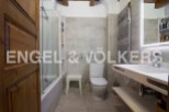 This stunning bathroom boasts a modern design with sleek white fixtures and a spacious shower.