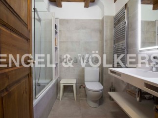 This stunning bathroom boasts a modern design with sleek white fixtures and a spacious shower.