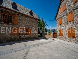 Discover this charming stone property nestled in a picturesque setting.