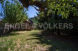 Discover this charming stone house nestled in a serene mountain setting.