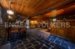 Rustic mountain home with a charming open-plan kitchen and dining area.