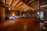 Rustic charm meets modern comfort in this unique property boasting exposed wooden beams and stone walls.