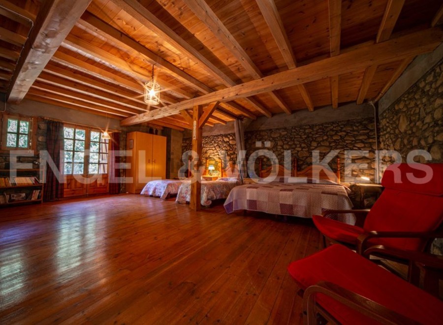 Rustic charm meets modern comfort in this unique wooden-beamed house.