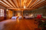 Rustic charm meets modern comfort in this unique property boasting a stunning wooden beamed ceiling and stone walls.