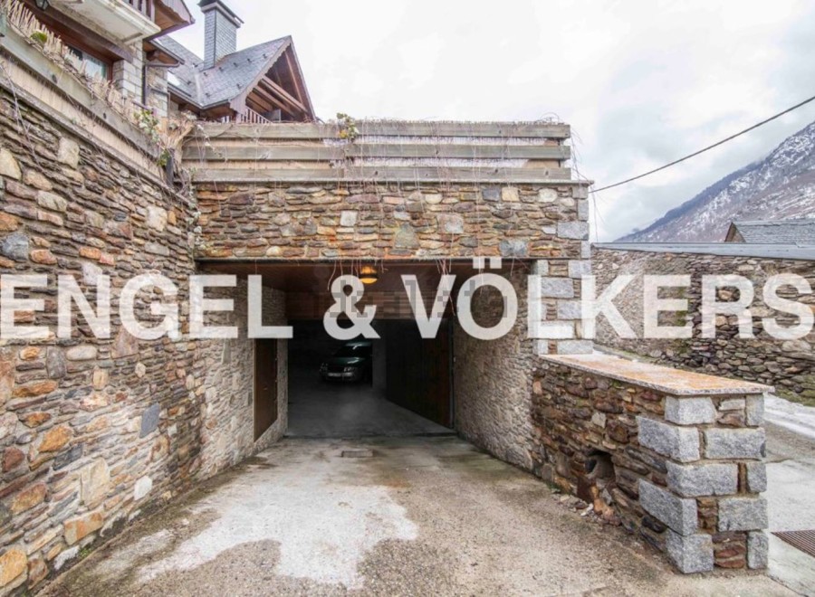This stunning property boasts a unique stone-built garage, offering secure parking and easy access.