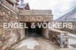 This stunning property boasts a unique stone-built garage, offering secure parking and easy access.