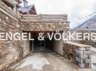 This stunning property boasts a unique stone-built garage, offering secure parking and easy access.