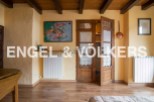 Charming rustic bedroom with wooden beamed ceiling and antique wardrobe.