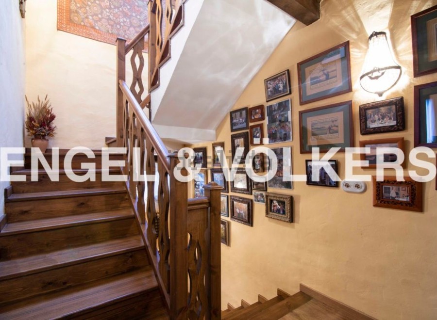 This charming property features a beautiful wooden staircase, adding a touch of elegance to the home.