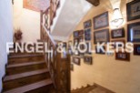 This charming property features a beautiful wooden staircase, adding a touch of elegance to the home.
