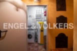 This stunning property boasts a dedicated laundry room complete with modern appliances, conveniently located just off the main hallway.