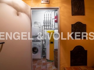 This stunning property boasts a dedicated laundry room complete with modern appliances, conveniently located just off the main hallway.