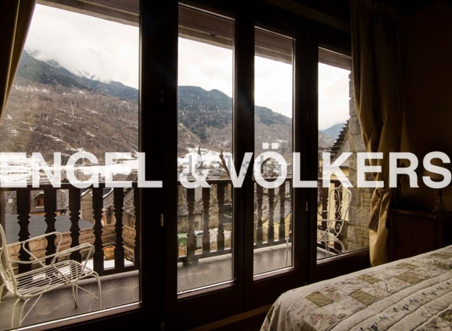 This stunning property boasts breathtaking mountain views from its large windows and private balcony.