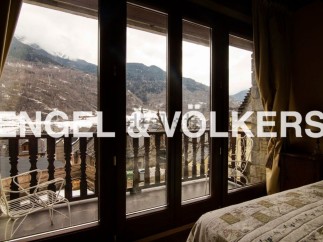 This stunning property boasts breathtaking mountain views from its large windows and private balcony.