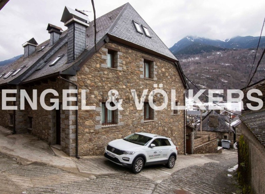 Charming stone house nestled in the mountains, offering stunning views.