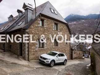 Charming stone house nestled in the mountains, offering stunning views.