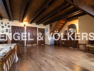 This stunning property boasts a spacious bedroom with antique wooden furniture and a beautiful wooden floor.