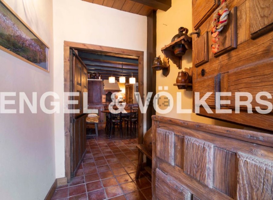 This charming property boasts a rustic interior with exposed wooden beams and antique furniture.