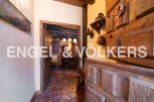 This charming property boasts a rustic interior with exposed wooden beams and antique furniture.