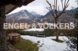 Mountain views and a snow-dusted garden greet you at this charming property.