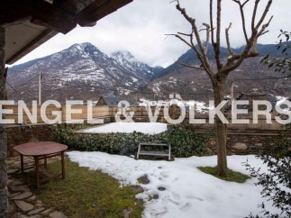 Mountain views and a snow-dusted garden greet you at this charming property.