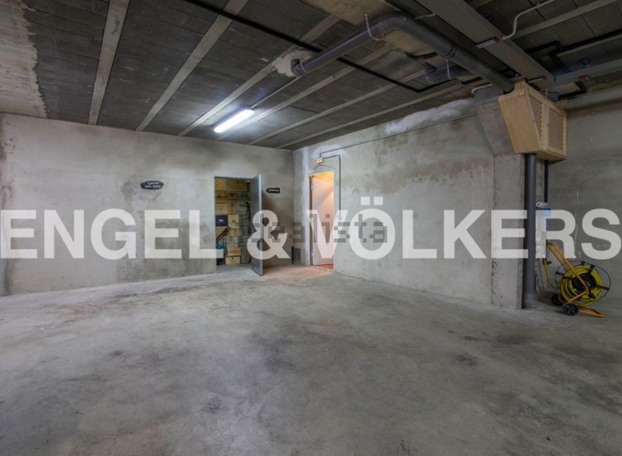 Spacious parking space with ample room for maneuvering.