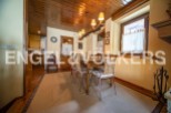 Charming dining room with wooden ceiling and rustic decor.