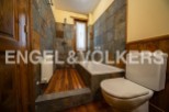 Charming bathroom with wooden features and slate tile.