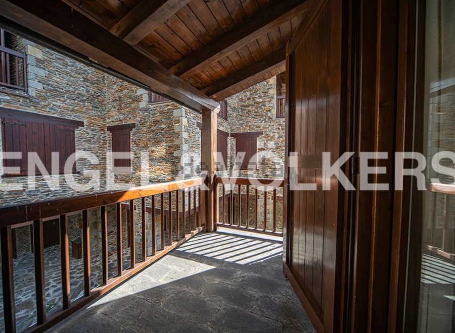 This stunning property boasts a unique balcony overlooking a charming courtyard, offering breathtaking views and ample natural light.