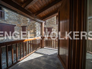 This stunning property boasts a unique balcony overlooking a charming courtyard, offering breathtaking views and ample natural light.