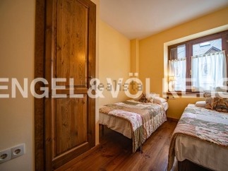 Charming bedroom with two twin beds, perfect for guests or children.
