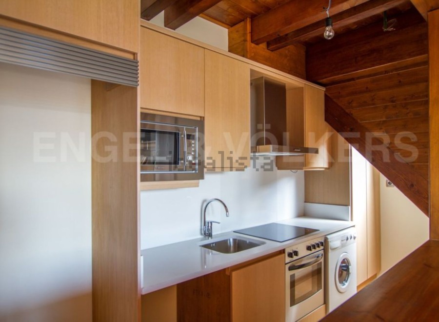 Charming apartment featuring a modern kitchen with integrated appliances.