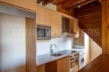 Charming apartment featuring a modern kitchen with integrated appliances.