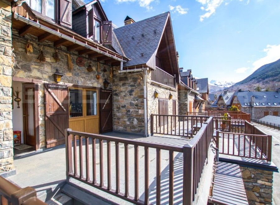 This stunning property boasts a spacious balcony with mountain views, perfect for enjoying the fresh air.