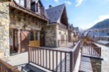 This stunning property boasts a spacious balcony with mountain views, perfect for enjoying the fresh air.