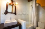 Charming bathroom with antique mirror and modern sink.