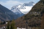 Nestled in a picturesque valley, this charming church boasts breathtaking views of snow-capped mountains.