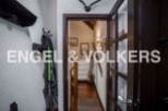 Charming chalet hallway with wooden floors and exposed beams.