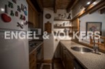 Charming kitchen with wooden cabinetry and granite countertops.