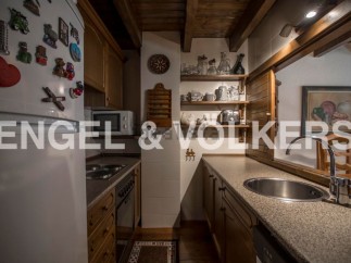 Charming kitchen with wooden cabinetry and granite countertops.