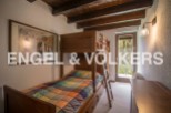 Charming wooden bunk bed in a cozy room, perfect for children.