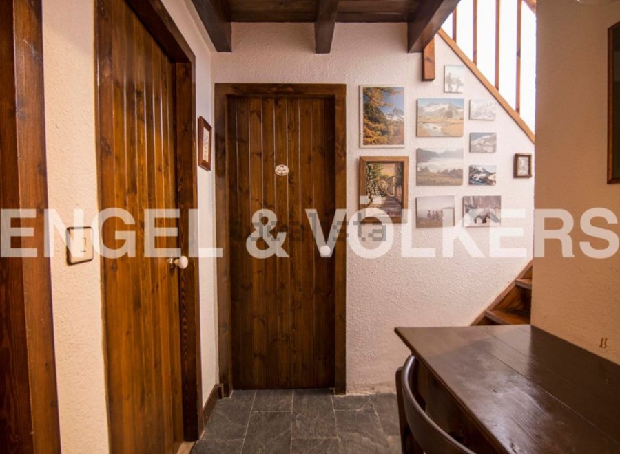 Charming wooden doors and floors create a cozy atmosphere in this unique property.