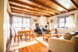 This stunning property boasts a spacious open-plan living area with a cozy fireplace, perfect for relaxing evenings.