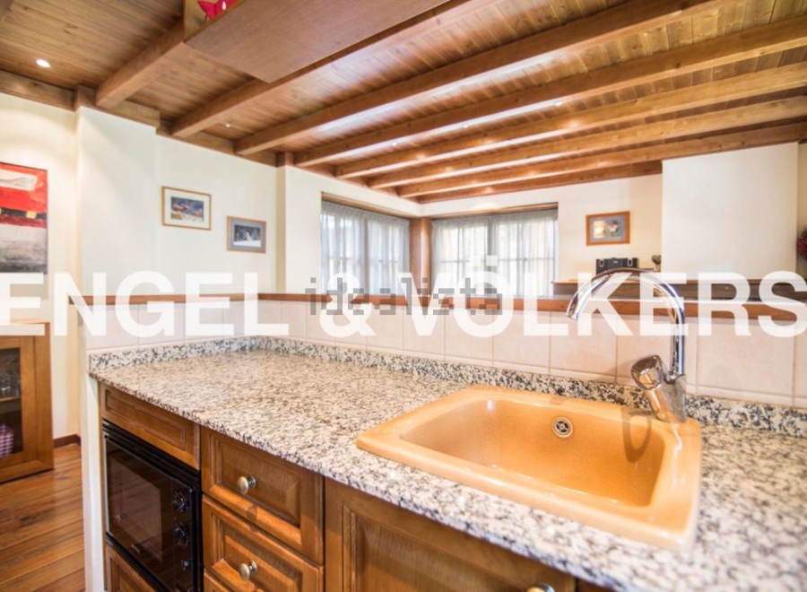 This stunning property boasts a beautiful kitchen with granite countertops and wooden cabinetry.
